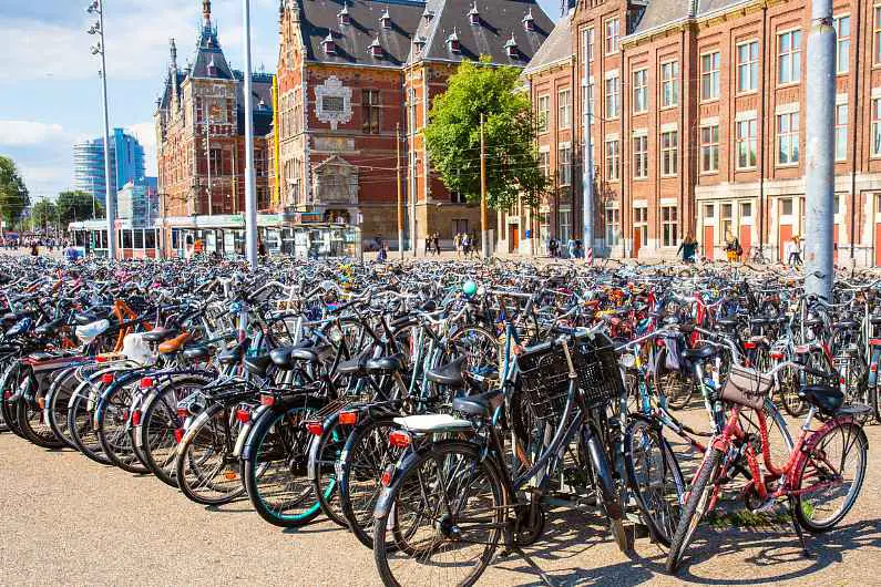 Rows of bikes stacked up outside a building in Amsterdam 