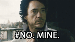 "You're overly protective of your belongings" - gif of Robert Downey Jr holding his bag closer 