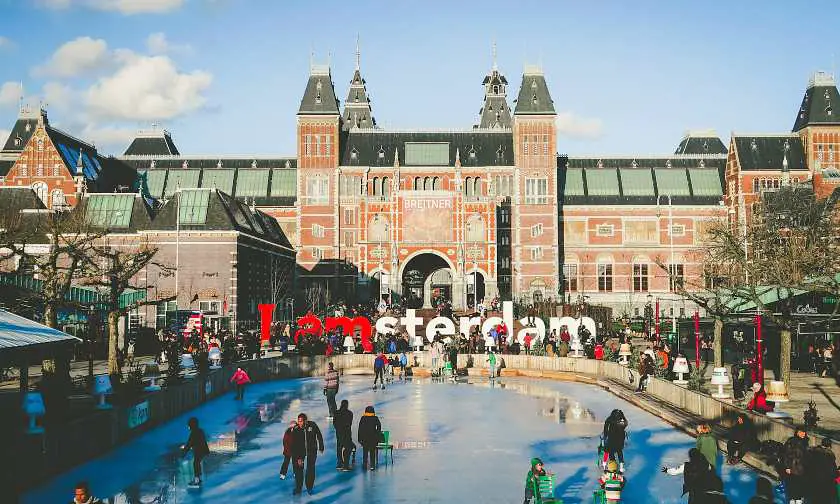 Ice skating rink in front of the rijksmuseum with the Iamsterdam sign in the background