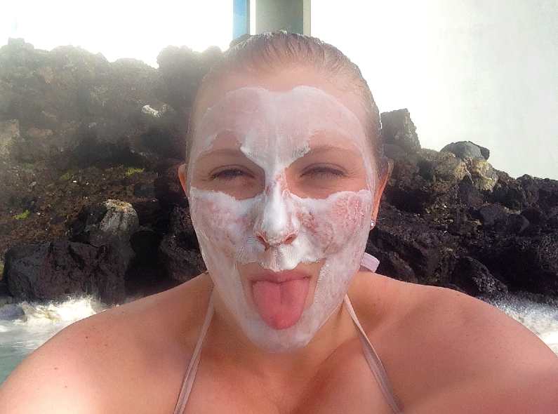 Mel sticking her tongue out wearing a white face mask at the Blue Lagoon