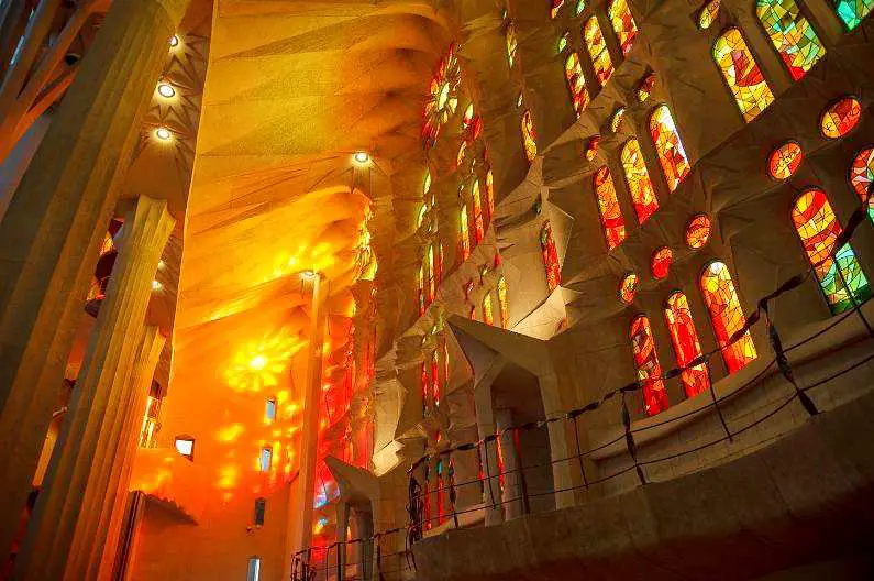 Orange stained glass windows inside Sagrada Familia 