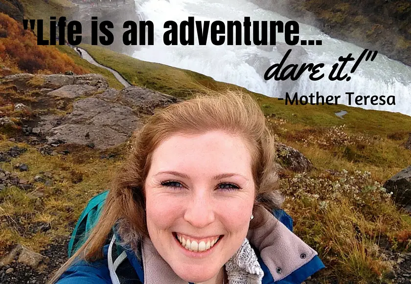 Mel smiling in front of the Gulfoss falls in Iceland selfie style with the quote “Life is an adventure…dare it!” by Mother Teresa, International Missionary at the top of the image