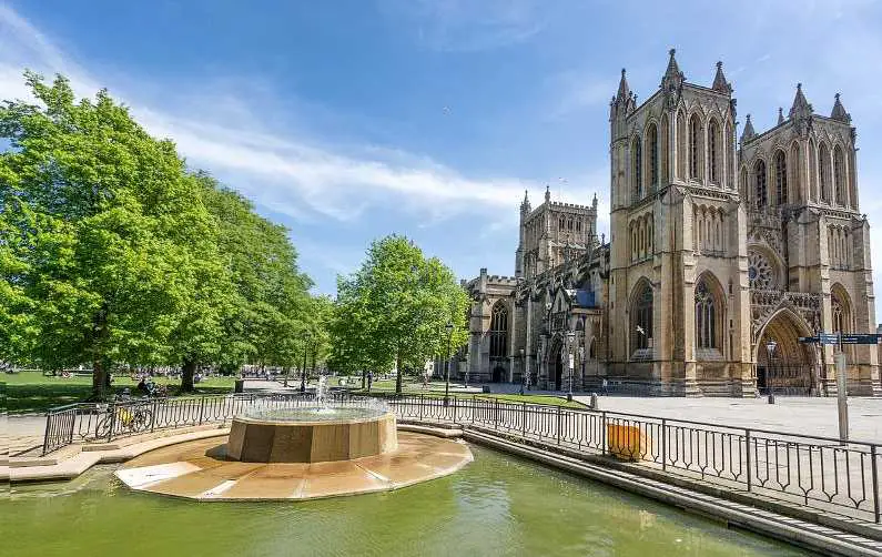 A gothic Bristol Cathedral in the College Green area of Bristol on a sunny day