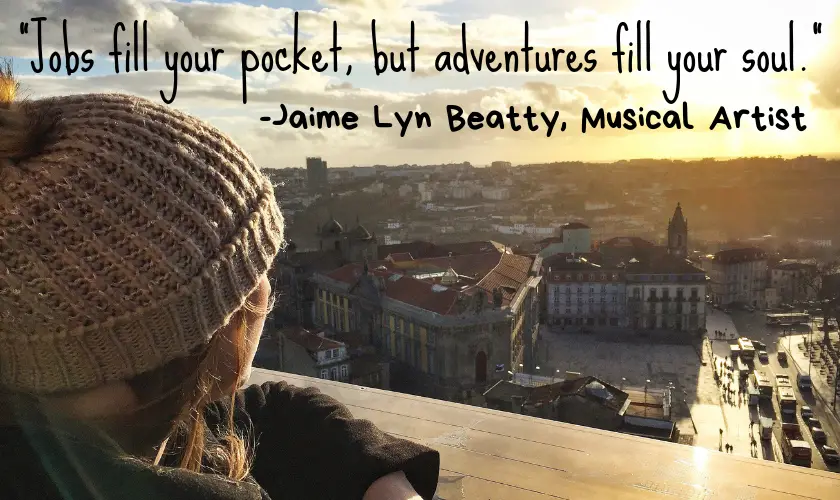 Mel looking out onto Porto city centre in Portugal from the cathedral balcony with the quote “Jobs fill your pocket, but adventures fill your soul.” by Jaime Lyn Beatty, Musical Artist