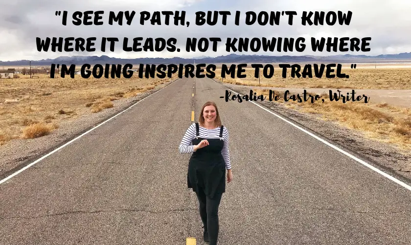 Mel walking down towards towards the camera down an open road in Nevada with the quote "I see my path, but I don’t know where it leads. Not knowing where I’m going is what inspires me to travel it." by Rosalia De Castro the Spanish Writer at the top of the image 