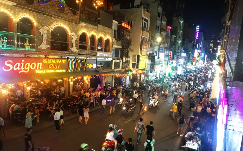 Partying district with a busy road full of traffic in Ho Chi Minh City in Vietnam