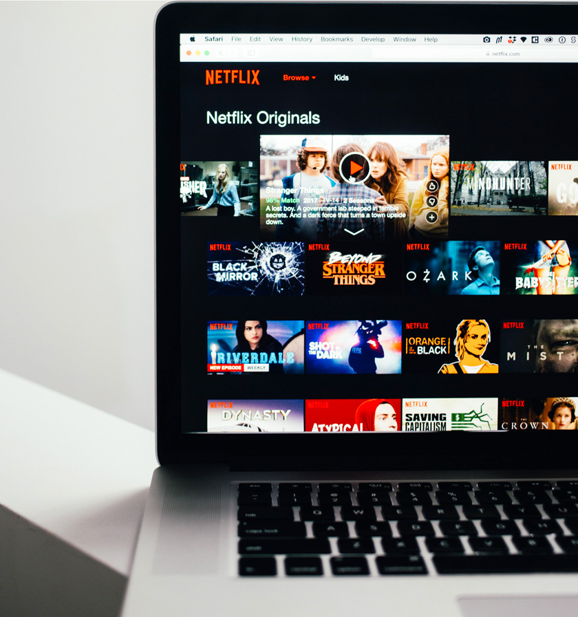 Netflix home screen on the screen of a mac laptop