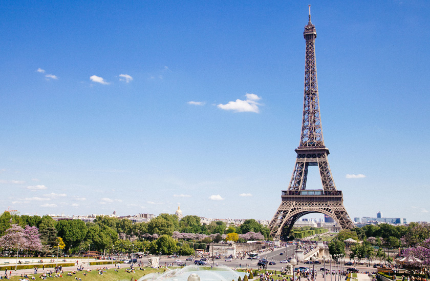 View of the Eiffel Tower with a bright blue sky 