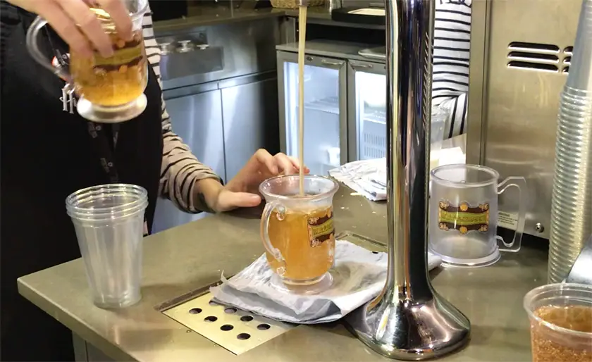 Vegan Buttebeers being poured without the cream into tankards