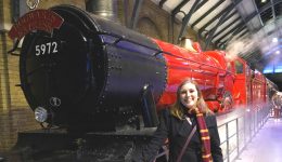 Mel in front of the Hogwarts Express red train