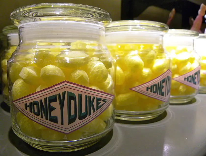 Non-vegan sherbet lemon hard candies in glass jars with Honeydukes on the label