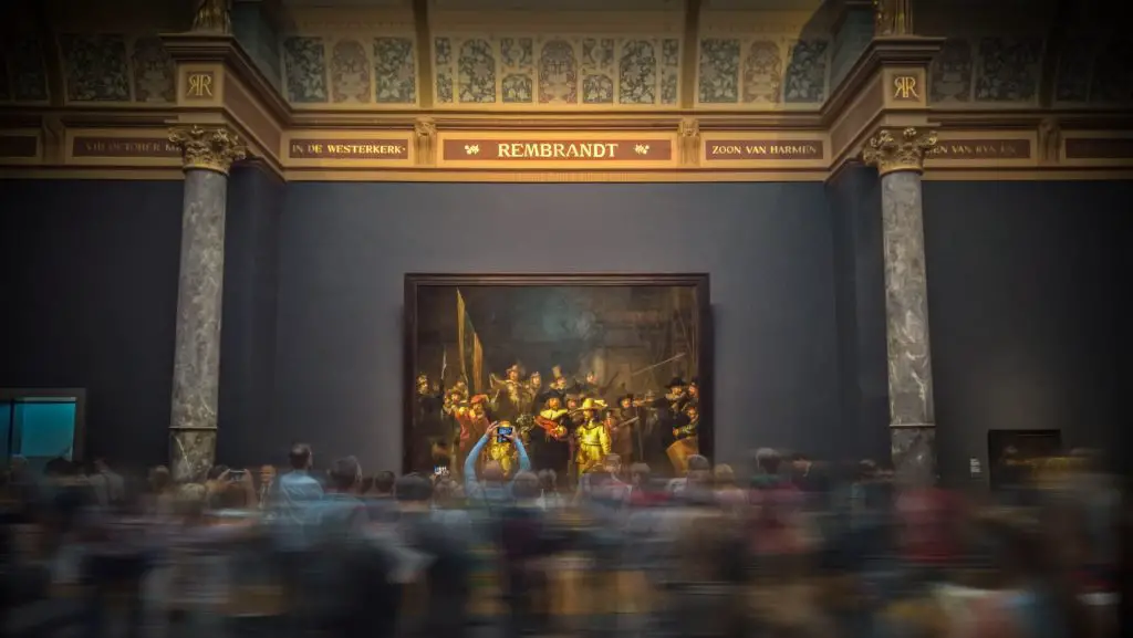 Rembrandt painting with a crowd in front it at the Rijks Museum in Amsterdam 