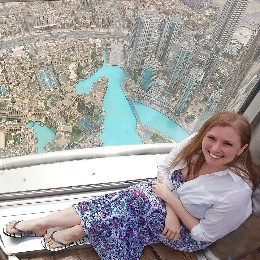 Mel sat by a window at the top of the Burj Khalifa