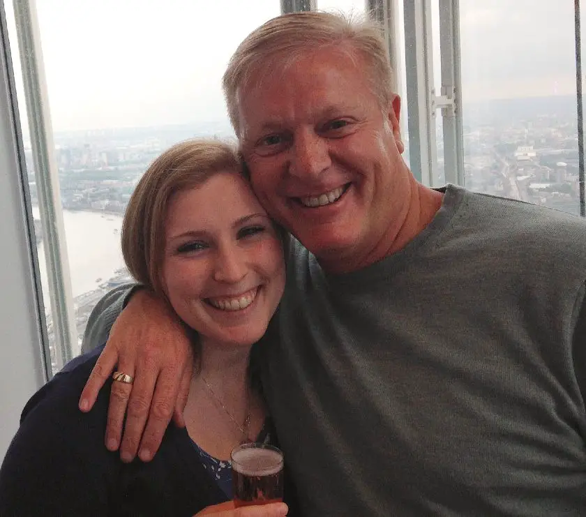 Mel smiling with her Dad with the view of London in the background