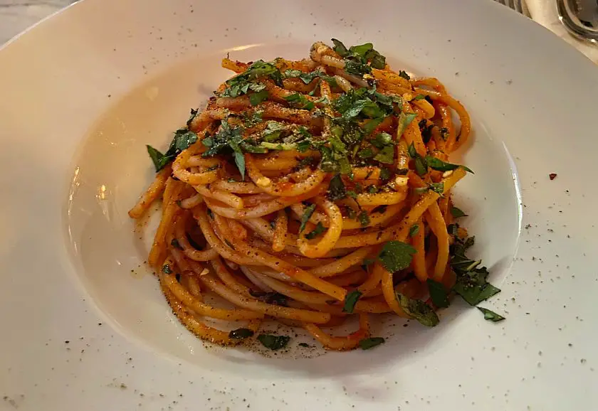 Arrabiata spaghetti with fresh parsley sprinkled on top 