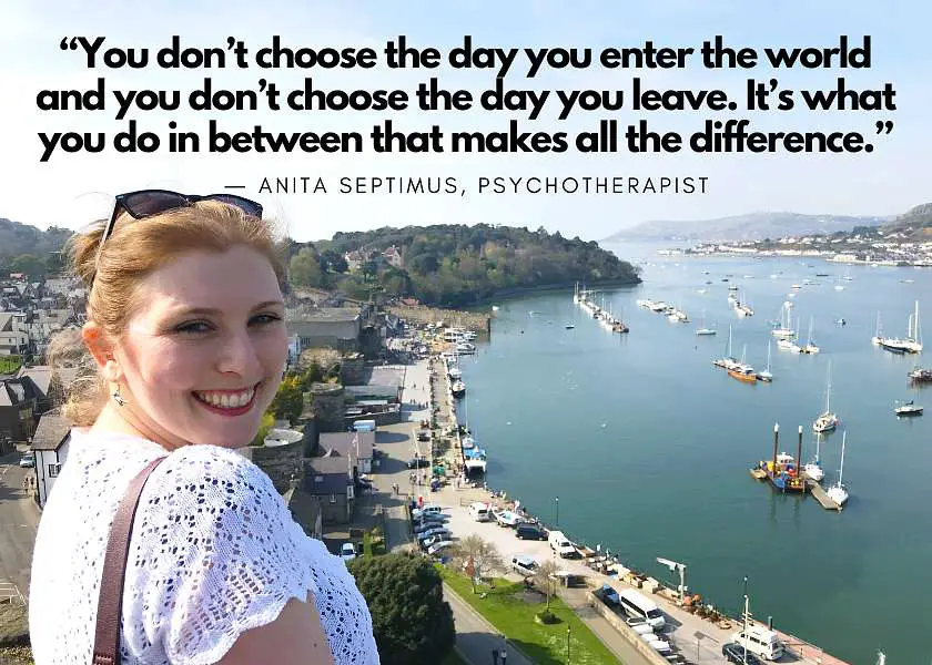 Mel smiling in front of Conwy harbour town in Wales on a sunny day with the quote: “You don’t choose the day you enter the world and you don’t choose the day you leave. It’s what you do in between that makes all the difference.” by Anita Septimus, Psychotherapist