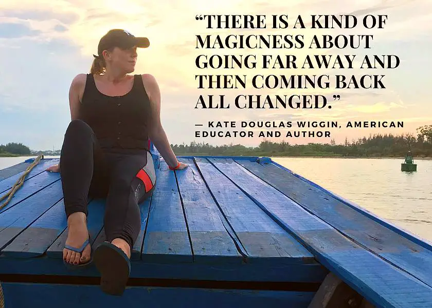 Mel on a blue boat looking out at the sunset in Cambodia with the quote: “There is a kind of magicness about going far away and then coming back all changed.” by Kate Douglas Wiggin, American Educator and Author at the top