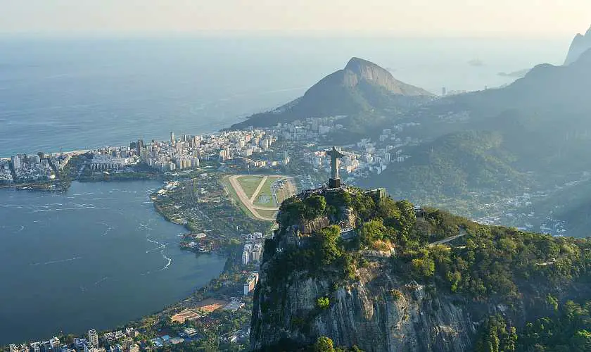 Rio de Janeiro skyline with Christ the Redeemers on top of a cliff seen from afar