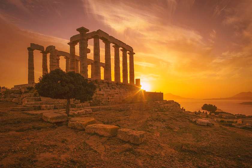 Greek temple ruins at sunset