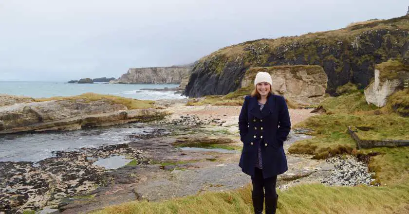 Mel standing at the back of Ballintoy Harbour in front of the beaches that were used in scenes for Stannis Barathian's storyline in Game of Thrones