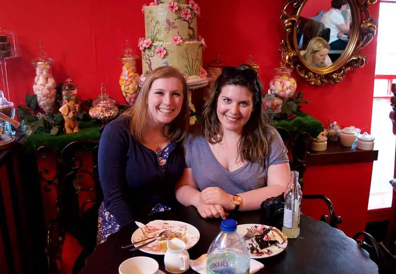 Mel and her best mate Tami smiling over afternoon tea at Choccywoccydoodah