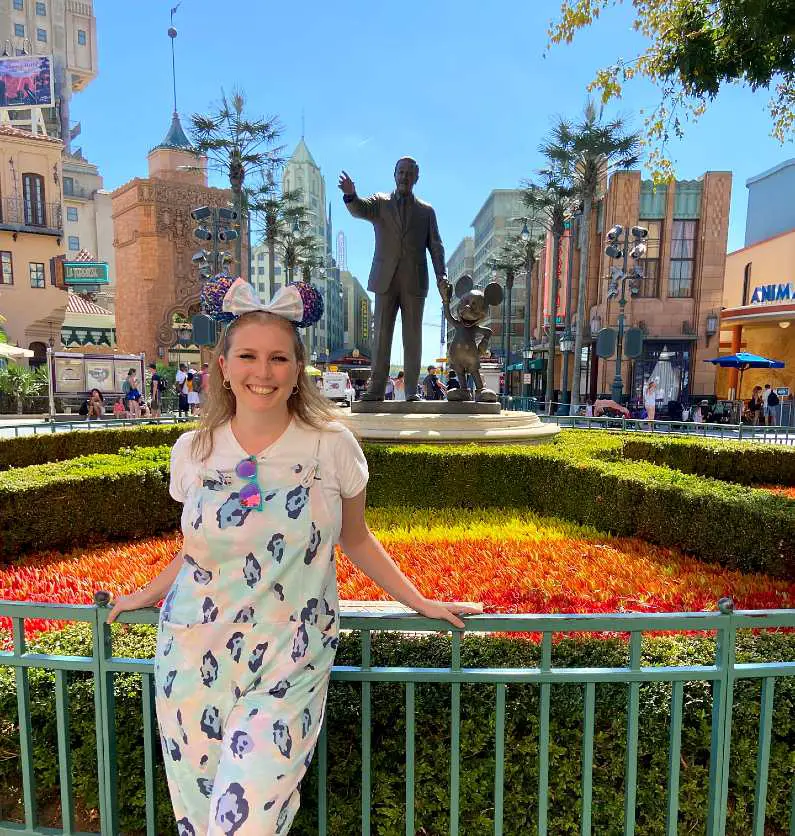 Mel stood in front of the Walt Disney and Mickey Mouse statue in the Disneyland Paris studios