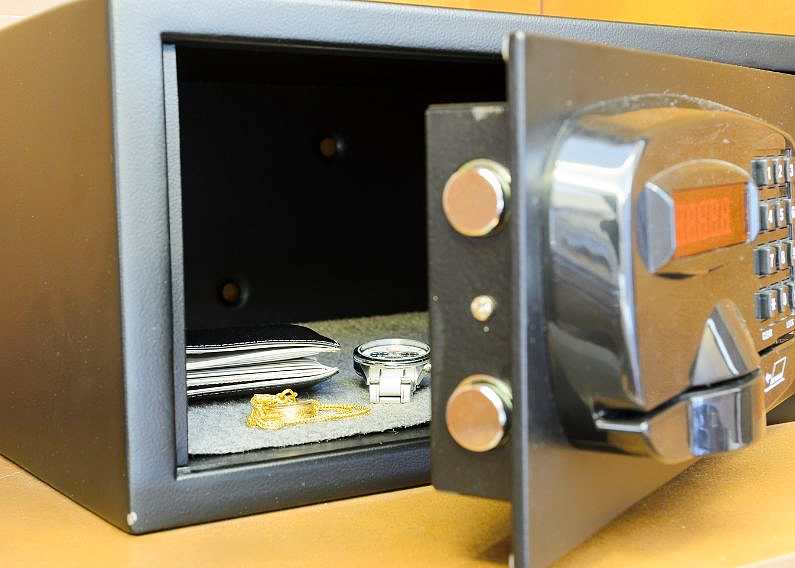 Wallet and watch inside a hotel safe upclose