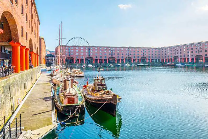 Albert Dock in Liverpool with boats tied up along the edge of the walkway
