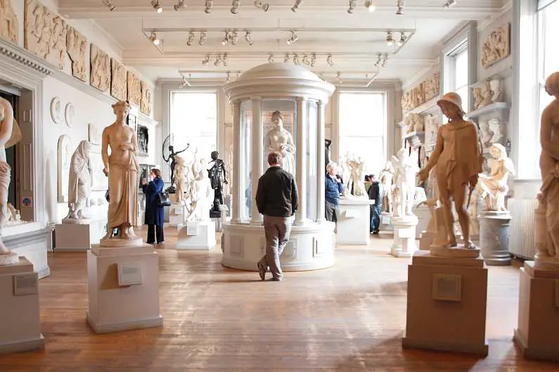 Inside the Walker Gallery in Liverpool in a room filled with ancient marbles statues 