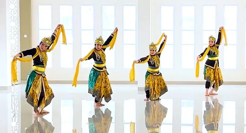 Traditional dancers in Bandung, performing wearing traditional costumes with crowns and yellow scarves