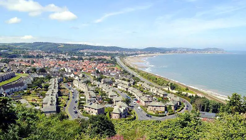 Colwyn Bay Beach in Wales surrounded by houses