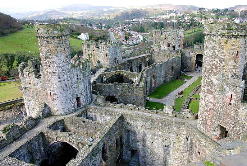 Inside Conwy castle, stone walls and sand paths