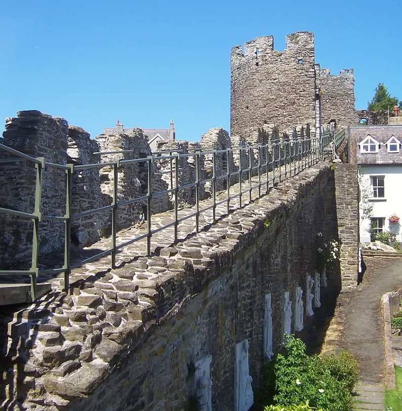 Medieval town walls in Conwy with railings