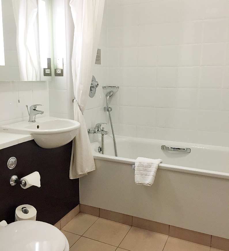 White bathroom in the Dragon Hotel in Swansea Bay