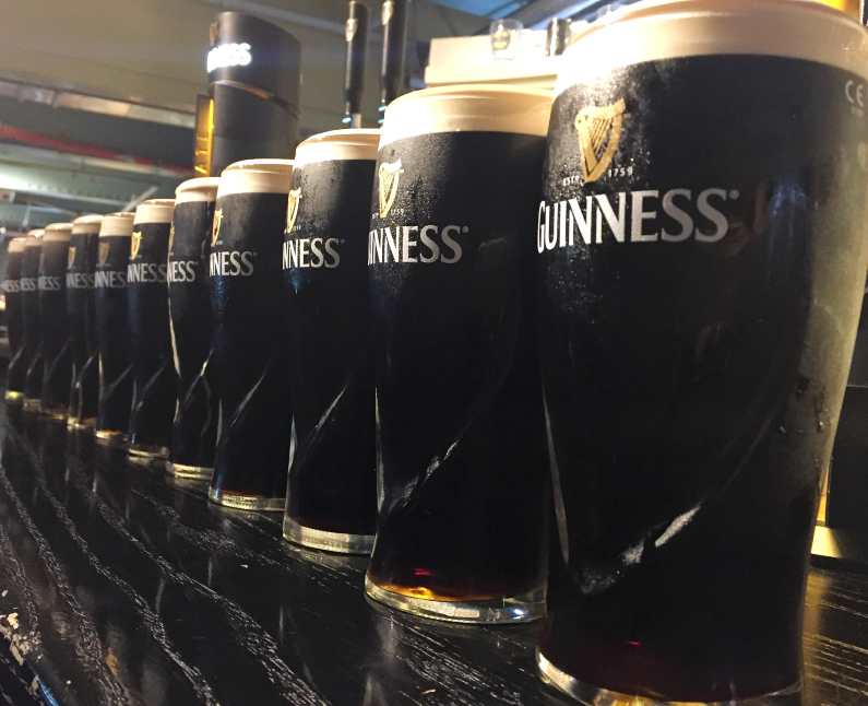 A row of Guinness pints 