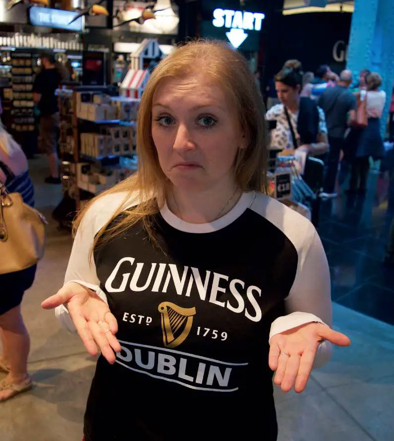 Mel modelling a Guinness Storehouse t-shirt and gesturing with her hands, "What do you think?"