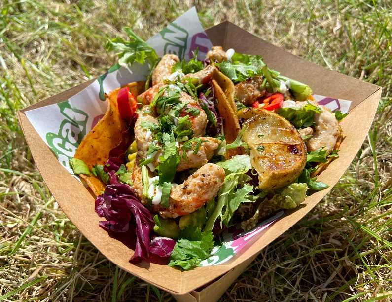 Tray of vegan shrimp tacos on grass from Filthy Vegan