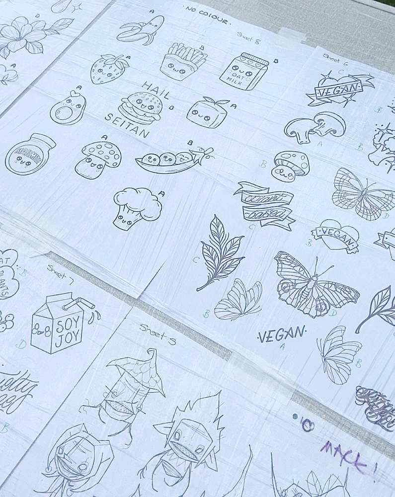 Papers with vegan tattoo designs on them
