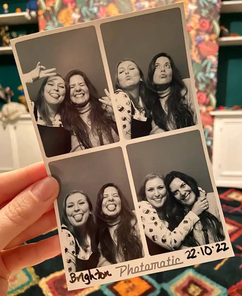 A photo of a photo booth picture with Mel and her friend Tami making lots of different faces