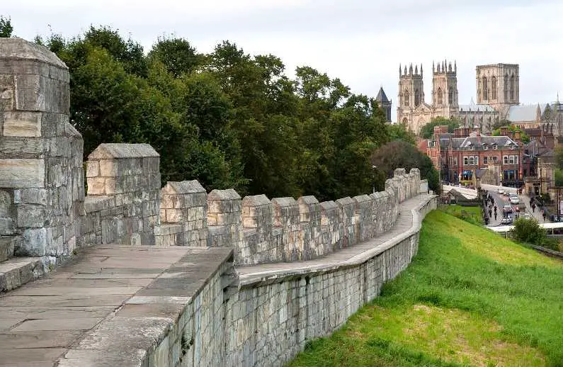 Roman walls in York with the old cathedral in the background
